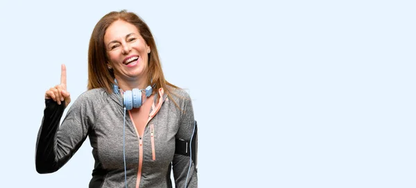 Middle Age Gym Fit Woman Workout Headphones Pointing Away Side — Stock Photo, Image