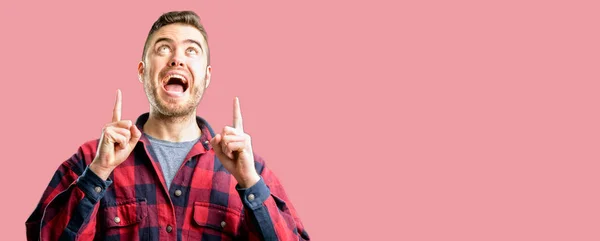 Young Handsome Man Happy Surprised Cheering Expressing Wow Gesture Pointing — Stock Photo, Image