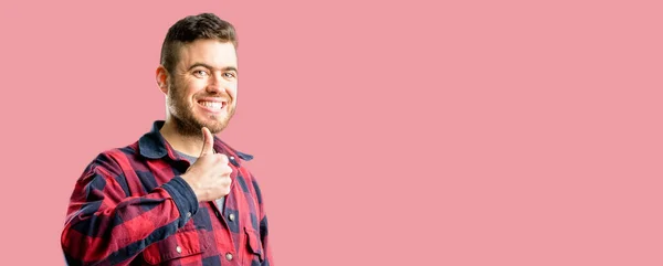 Jovem Bonito Homem Sorrindo Amplamente Mostrando Polegares Até Gesto Para — Fotografia de Stock