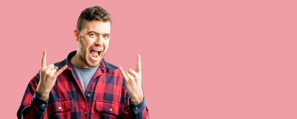 Young Handsome Man Making Rock Symbol Hands Shouting Celebrating — Stock Photo, Image