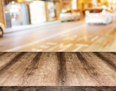 Wooden empty table board in front of blurred background. Can be  clipart