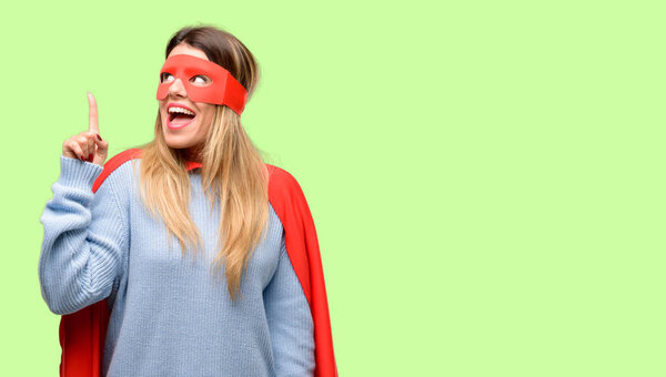 Young super woman raising finger, the number one