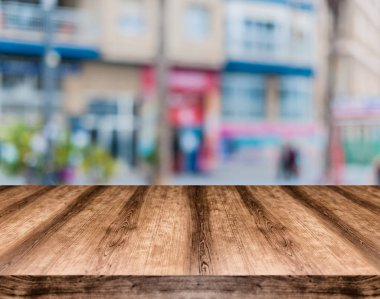 Wooden empty table board in front of blurred background. Can be  clipart