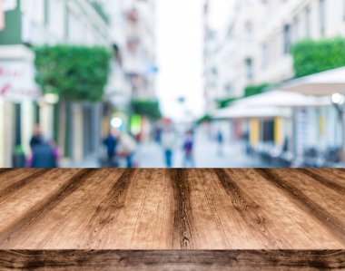 Wooden empty table board in front of blurred background. Can be  clipart