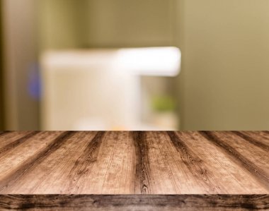 Wooden empty table board in front of blurred background. Can be  clipart