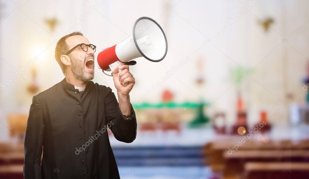 Priest religion man communicates shouting loud holding a megaphone, expressing success and positive concept, idea for marketing or sales at church