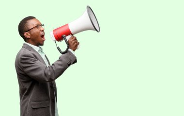 African black man wearing jacket communicates shouting loud holding a megaphone, expressing success and positive concept, idea for marketing or sales clipart