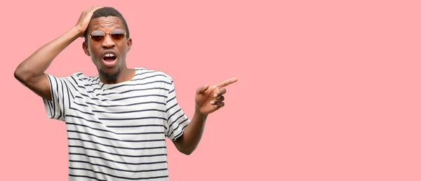 African Black Man Wearing Sunglasses Pointing Away Side Finger — Stock Photo, Image