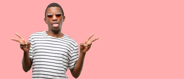 African Black Man Wearing Sunglasses Looking Camera Showing Tong Making — Stock Photo, Image