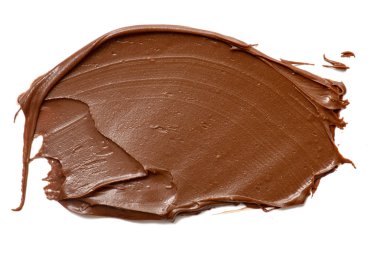 Krem çikolata üzerinde beyaz artalanları izole yayılıyor. Gıda ba