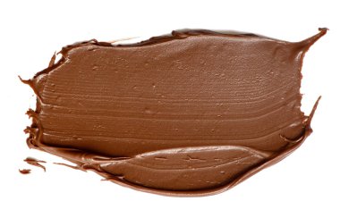 Krem çikolata üzerinde beyaz artalanları izole yayılıyor. Gıda ba