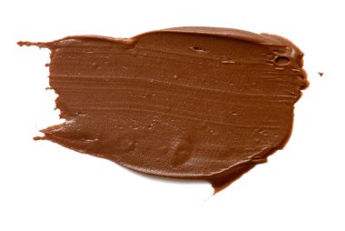 Krem çikolata üzerinde beyaz artalanları izole yayılıyor. Gıda ba