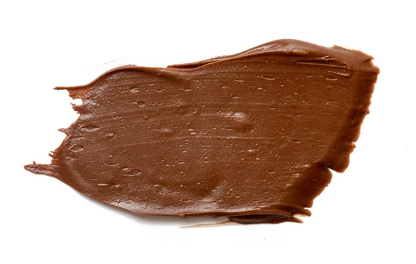 Chocolate crema extendiéndose aislado sobre fondo blanco. Alimentación ba — Foto de Stock