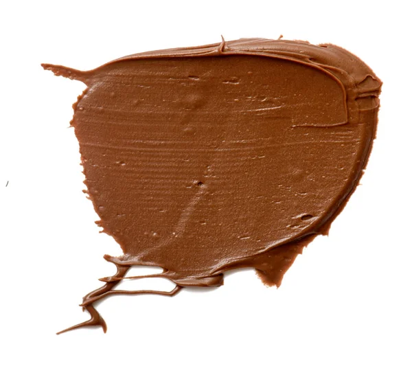 Chocolate crema extendiéndose aislado sobre fondo blanco. Alimentación ba — Foto de Stock