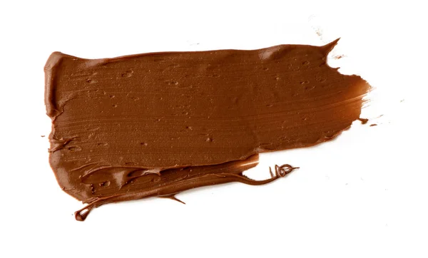Chocolate espalhado isolado sobre fundo branco. Comida deliciosa — Fotografia de Stock