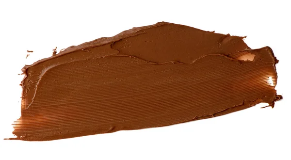 Chocolate espalhado isolado sobre fundo branco. Comida deliciosa — Fotografia de Stock
