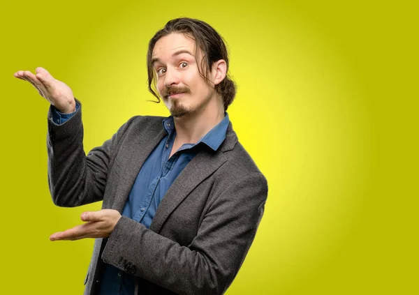 Handsome Young Man Holding Something His Empty Hand — Stock Photo, Image