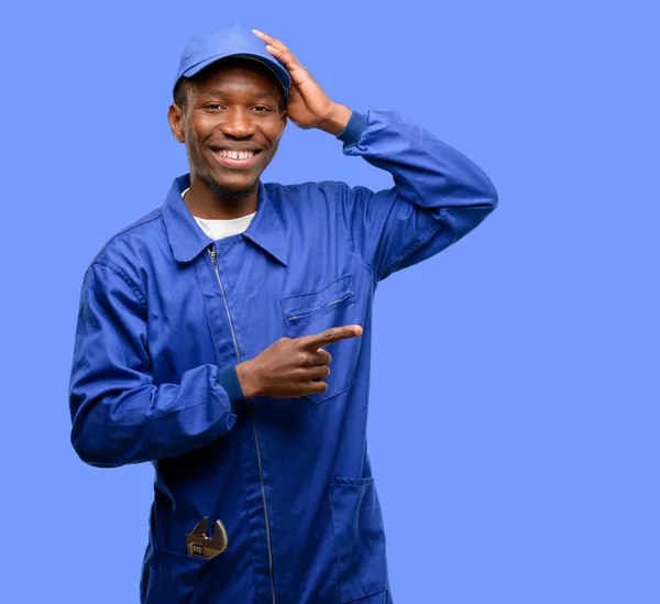 African black plumber man pointing away side with finger