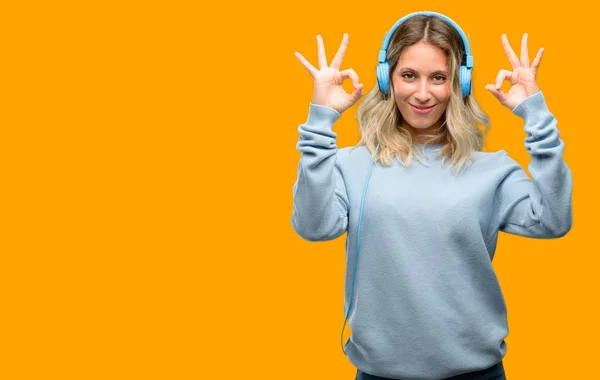 Young Beautiful Woman Listening Music Doing Sign Gesture Both Hands — Stock Photo, Image