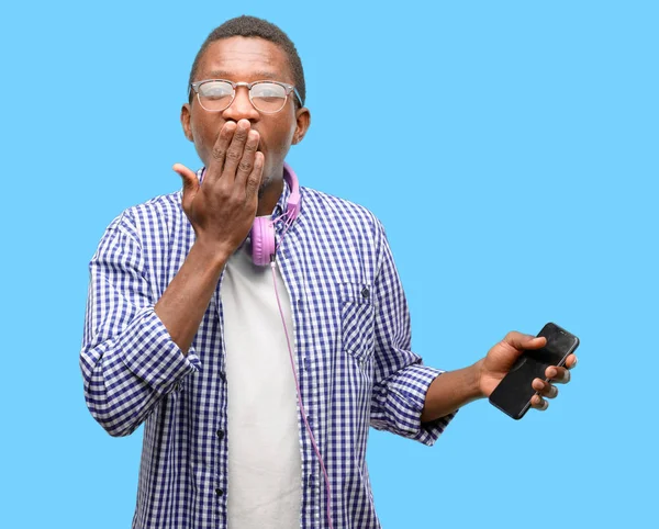 African Black Man Student Smartphone Covers Mouth Shock Looks Shy — Stock Photo, Image