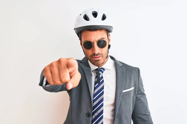 Young handsome business man wearing bike helmet and sunglasses over isolated background pointing with finger to the camera and to you, hand sign, positive and confident gesture from the front