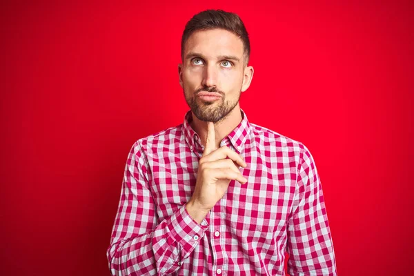 Young Handsome Man Red Isolated Background Thinking Concentrated Doubt Finger — Stock Photo, Image