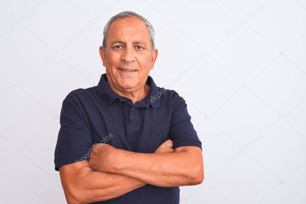 Senior grey-haired man wearing black casual polo standing over isolated white background happy face smiling with crossed arms looking at the camera. Positive person.