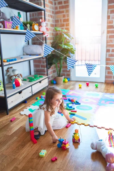 Adorable Blonde Toddler Playing Train Toy Lots Toys Kindergarten — Stock Photo, Image