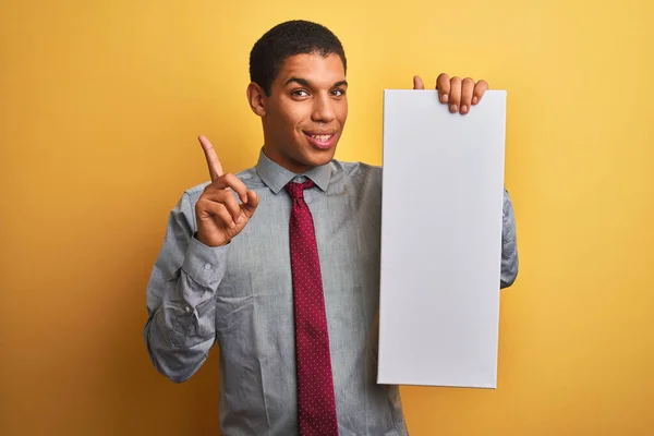 Young Handsome Arab Businessman Holding Banner Standing Isolated Yellow Background — Stock Photo, Image