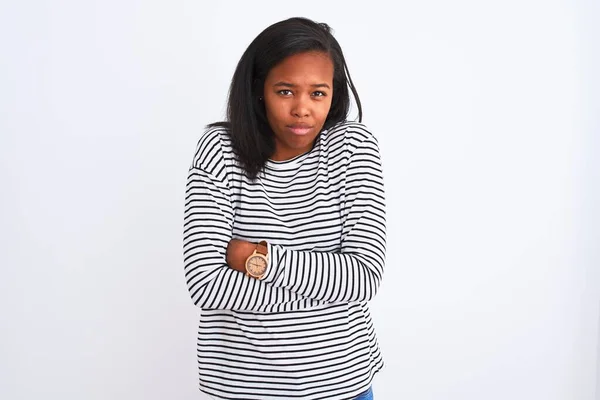 Beautiful young african american woman wearing winter sweater over isolated background shaking and freezing for winter cold with sad and shock expression on face