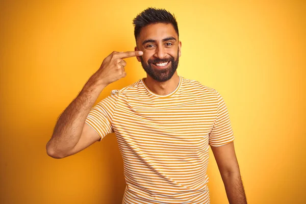 Young Indian Man Wearing Shirt Standing Isolated Yellow Background Pointing — ストック写真
