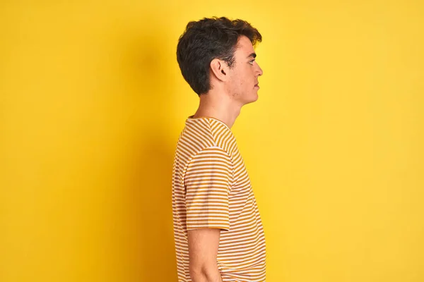 Teenager Boy Wearing Yellow Shirt Isolated Background Looking Side Relax — Stock Photo, Image