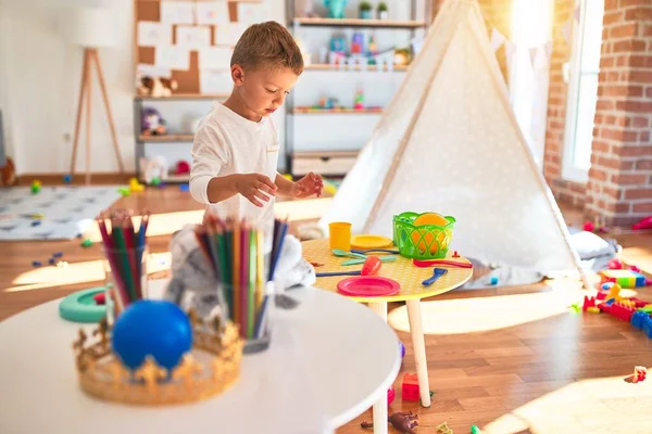 Beautiful Blonde Toddler Playing Plastic Food Dishes Standing Lots Toys — Stock Photo, Image