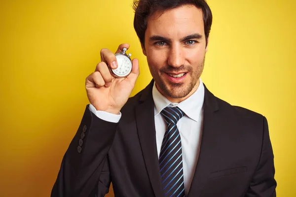 Young Handsome Businessman Holding Stopwatch Standing Isolated Yellow Background Happy — Stock Photo, Image