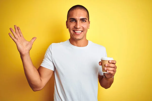 Young Handsome Man Drinking Take Away Glass Coffee Yellow Isolated — ストック写真