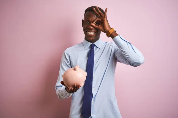 African American Businessman Holding Piggy Bank Standing Isolated Pink Background — Stockfoto