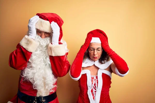 Middle Age Couple Wearing Santa Costume Glasses Isolated Yellow Background — Stock Photo, Image