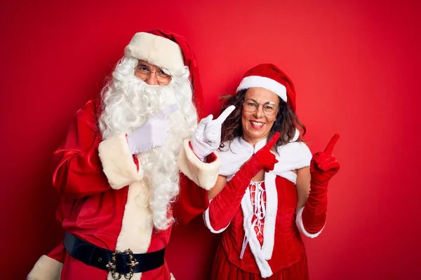 Middle Age Couple Wearing Santa Costume Glasses Isolated Red Background — Stock Photo, Image