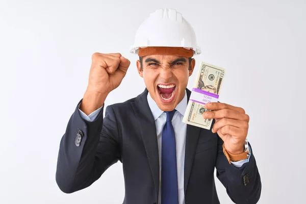 Joven Arquitecto Guapo Con Casco Sosteniendo Dólares Sobre Fondo Blanco —  Fotos de Stock