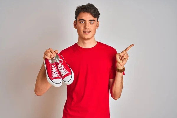Teenager Boy Holding Fashion Casual Sneakers Red Isolated Background Very — ストック写真