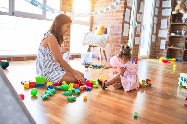 Young Beautiful Teacher Toddler Sitting Floor Playing Building Blocks Toy — Stock Photo, Image