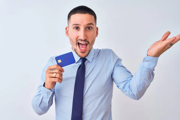 Young Business Man Holding Credit Card Isolated Background Very Happy — Stock Photo, Image