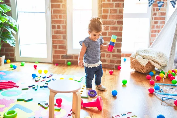 Beautiful Toddler Standing Playing Colorful Plastic Cups Kindergarten — Stock Photo, Image