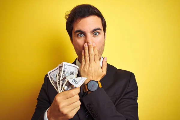 Young Handsome Businessman Wearing Suit Holding Dollars Isolated Yellow Background — Stock Photo, Image