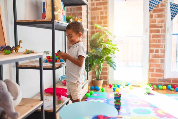 Beautiful African American Toddler Standing Playing Small Building Blocks Shelving — Stock Photo, Image