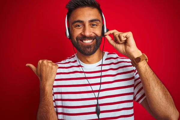 Young Indian Call Center Agent Man Using Headset Isolated Red — Stock Photo, Image