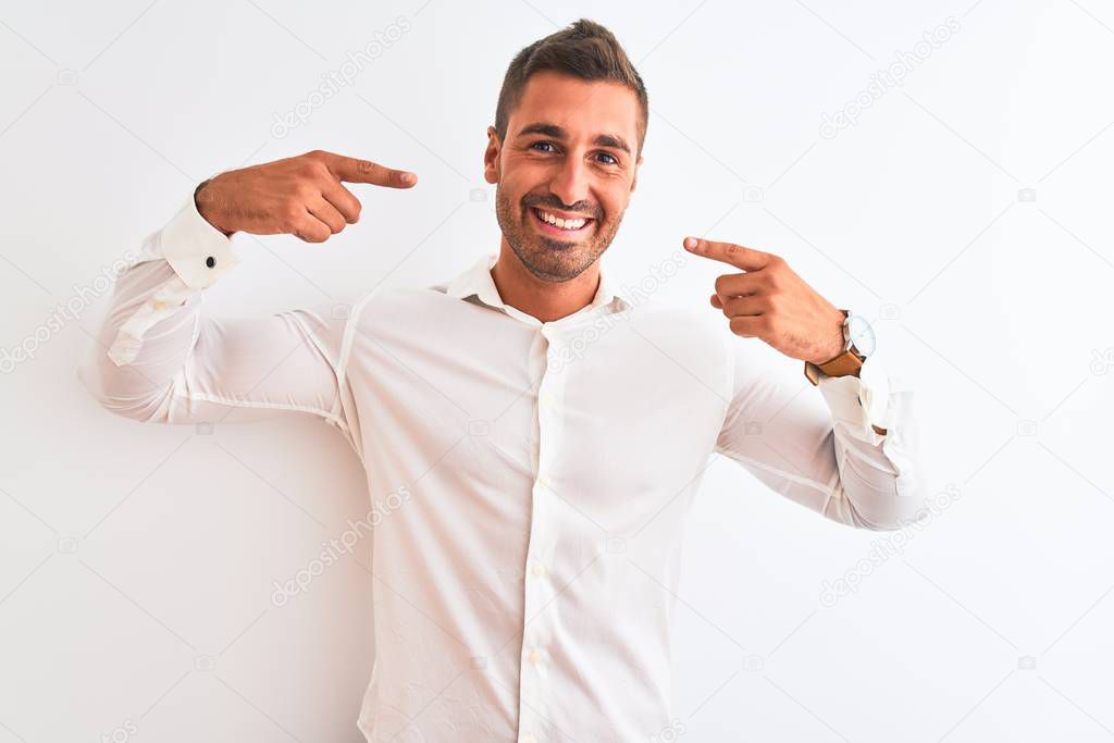 Young handsome business man wearing elegant shirt over isolated background smiling cheerful showing and pointing with fingers teeth and mouth. Dental health concept.
