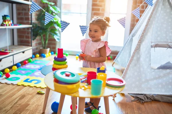 Young Beautiful Toddler Smiling Building Pyramid Using Hoops Table Kindergaten — Stock Photo, Image