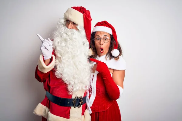 Middle Age Couple Wearing Santa Costume Hugging Isolated White Background — Stock Photo, Image