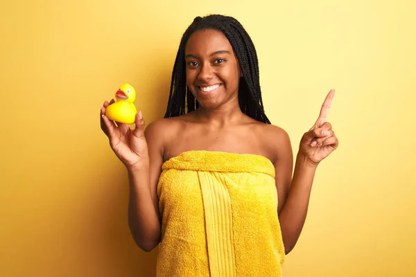African American Woman Wearing Shower Towel Holding Toy Duck Isolated — Stock Photo, Image